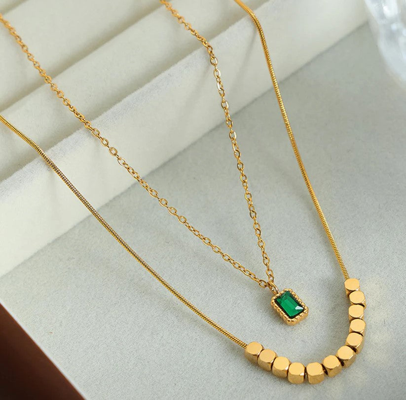 Elegant Emerald Envy Necklace with Yellow Gold Plating, featuring a stunning design that is anti-tarnish and hypoallergenic, perfect for fashion-forward looks.