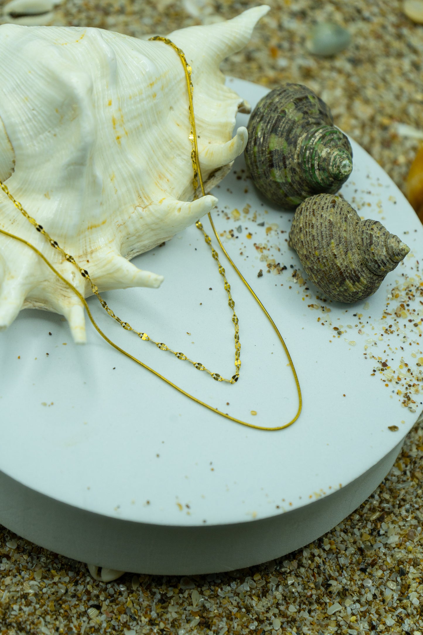 Delicate layered necklace with yellow gold plating, anti-tarnish finish, and hypoallergenic design.