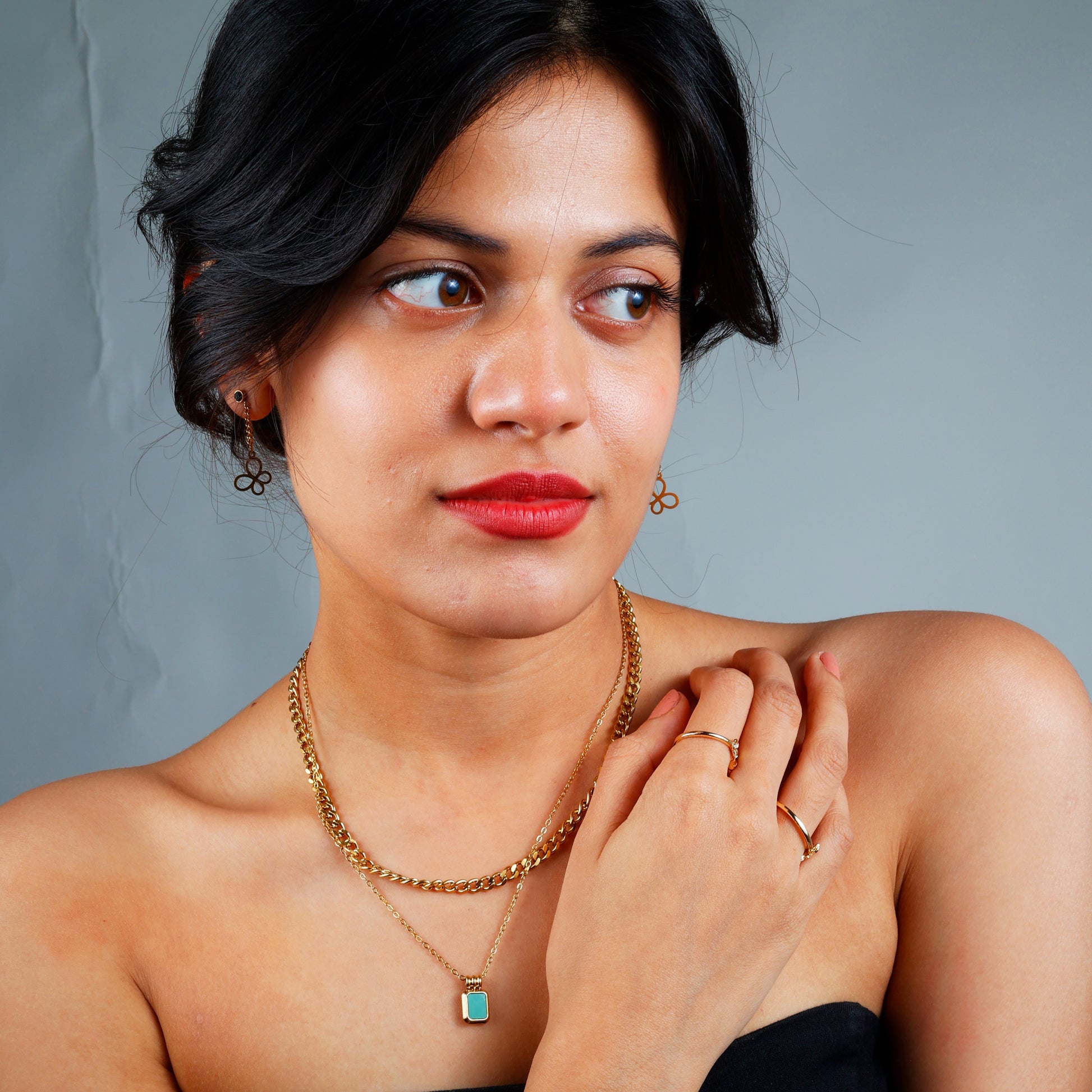 Stylish Green Stone Layered Necklace with yellow gold plating, hypoallergenic design, and anti-tarnish finish.