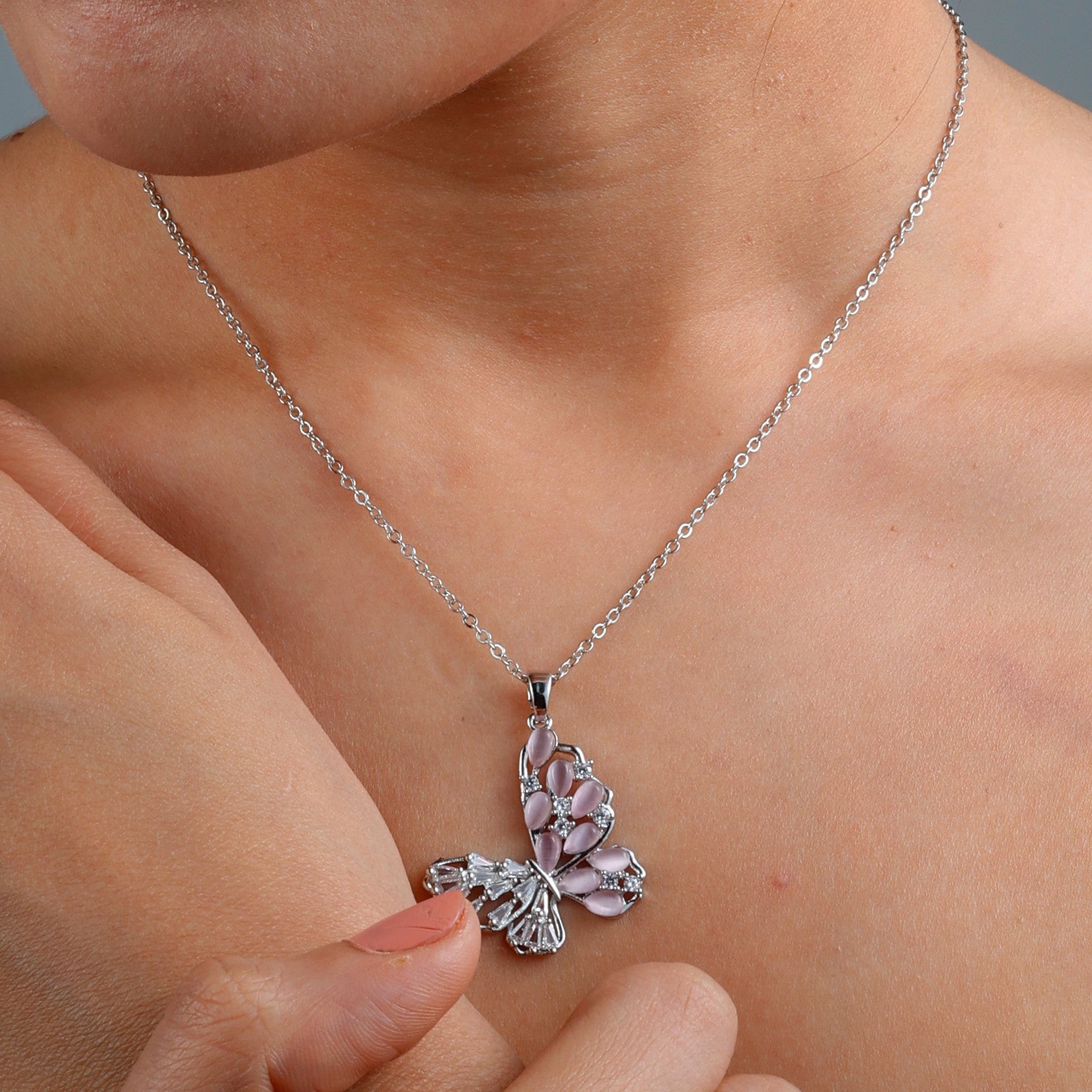 Elegant Pink Butterfly Necklace with rhodium plating, anti-tarnish finish, and hypoallergenic design.