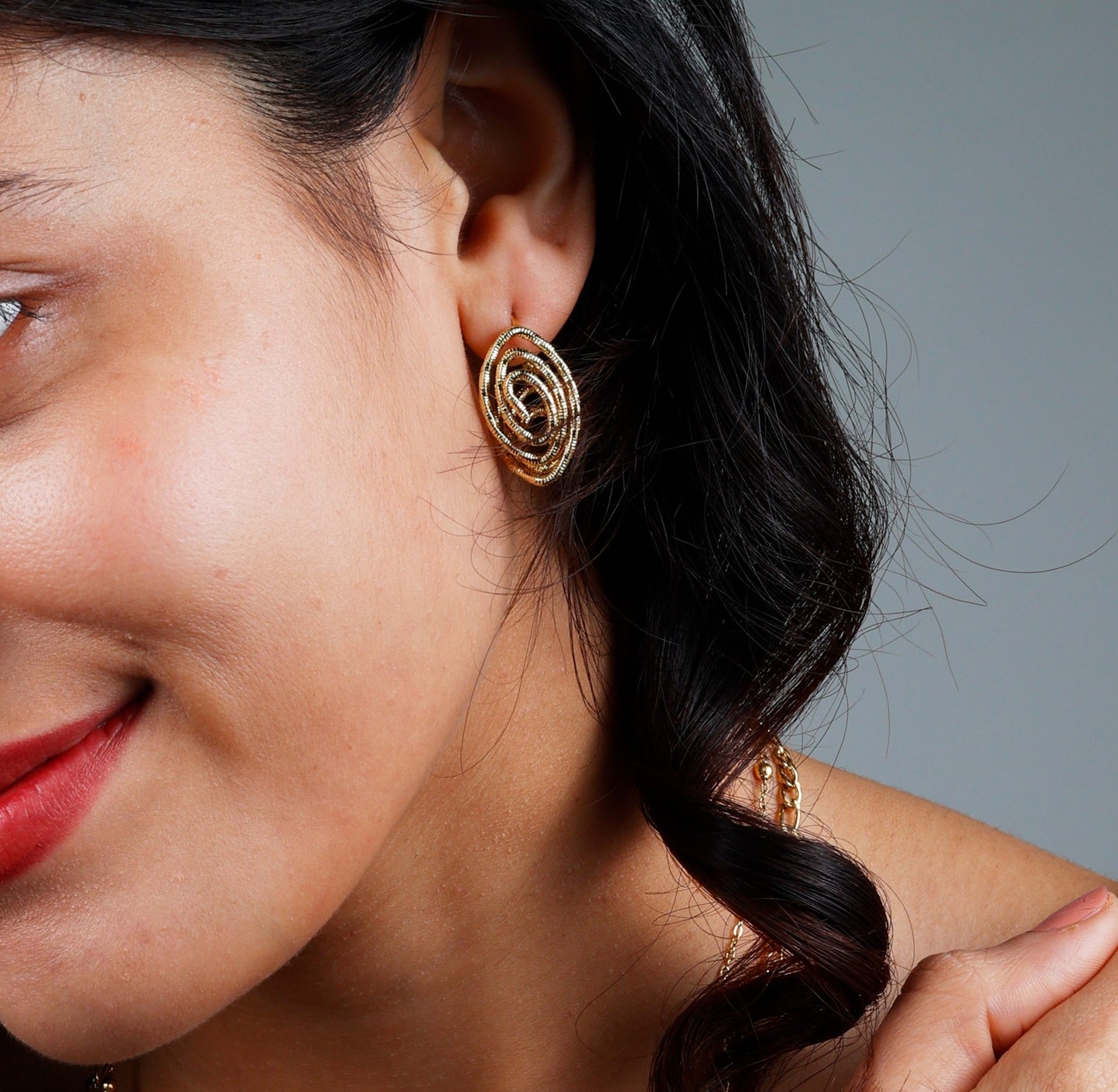 Elegant Whirlwind Earrings with yellow gold plating, anti-tarnish finish, and hypoallergenic design.