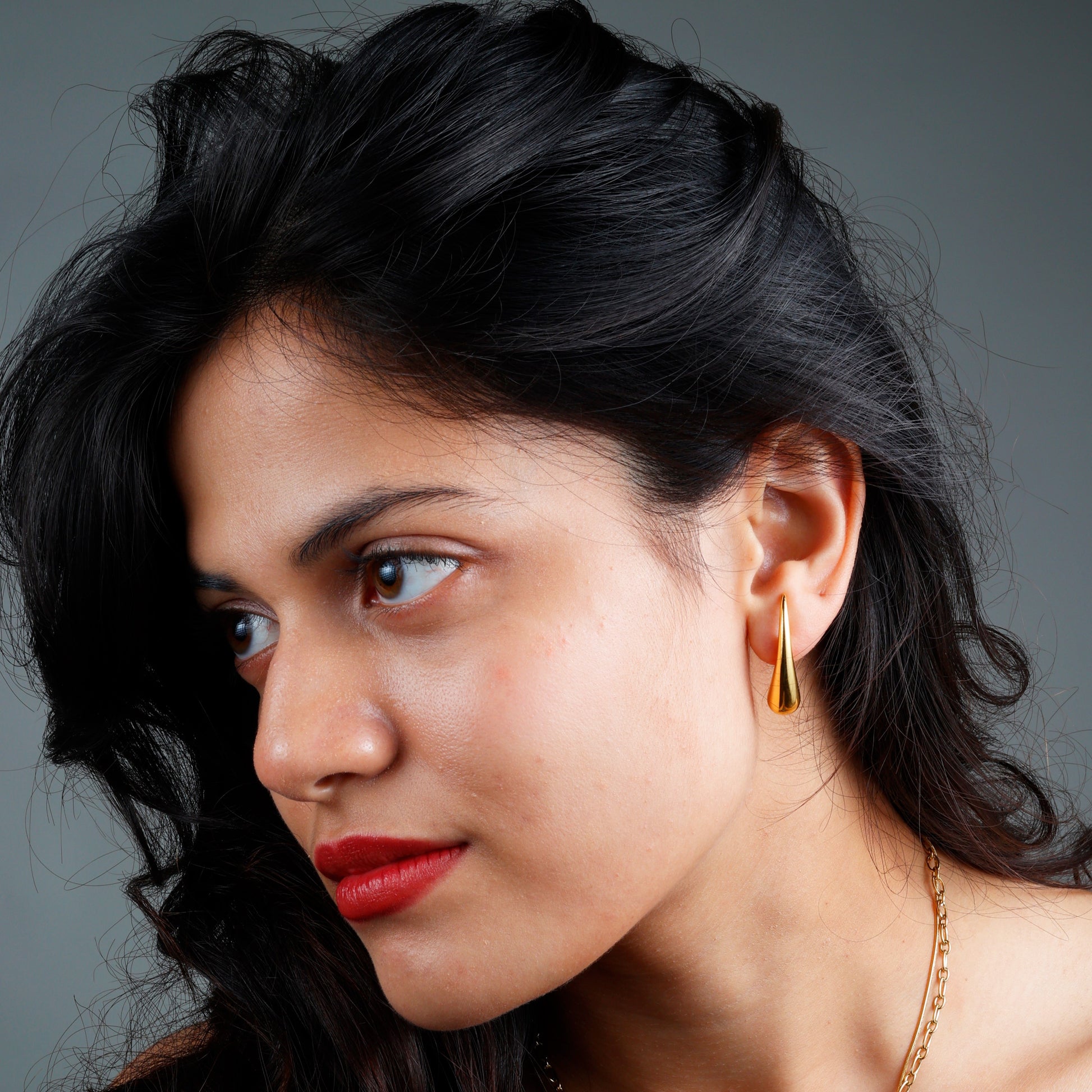 Elegant Minimalist Teardrop Earrings with yellow gold plating and anti-tarnish finish.