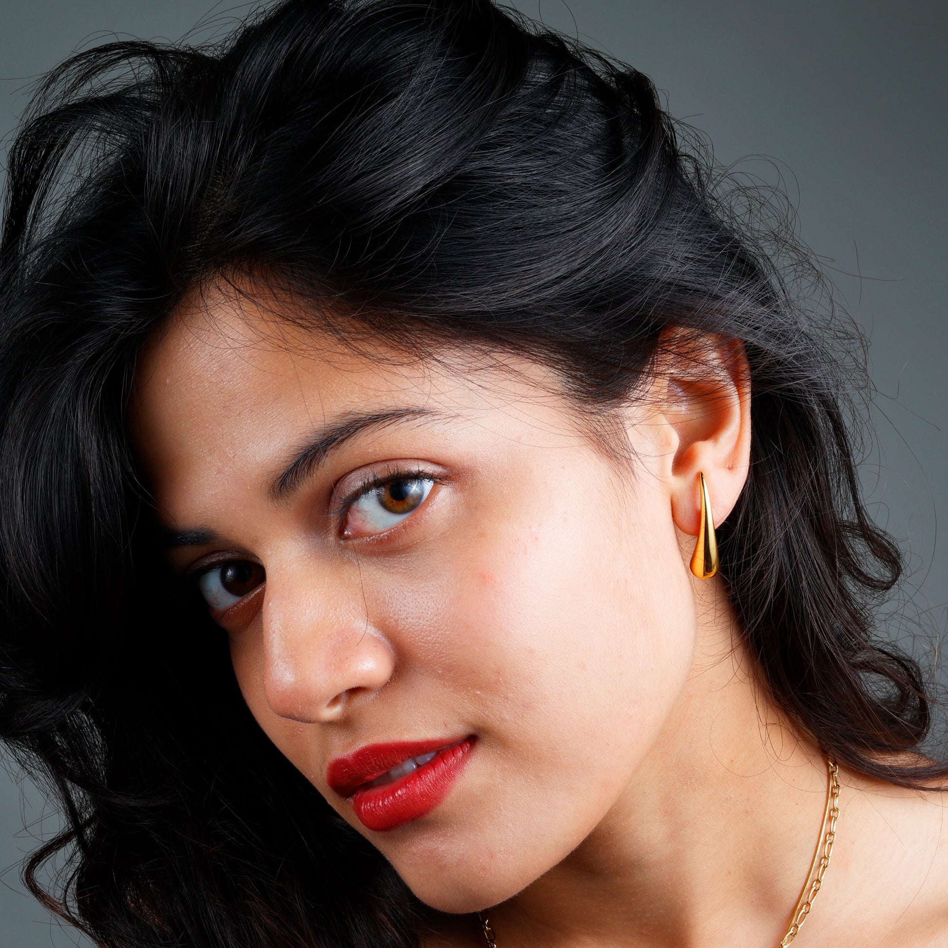 Elegant Minimalist Teardrop Earrings with yellow gold plating and anti-tarnish finish.