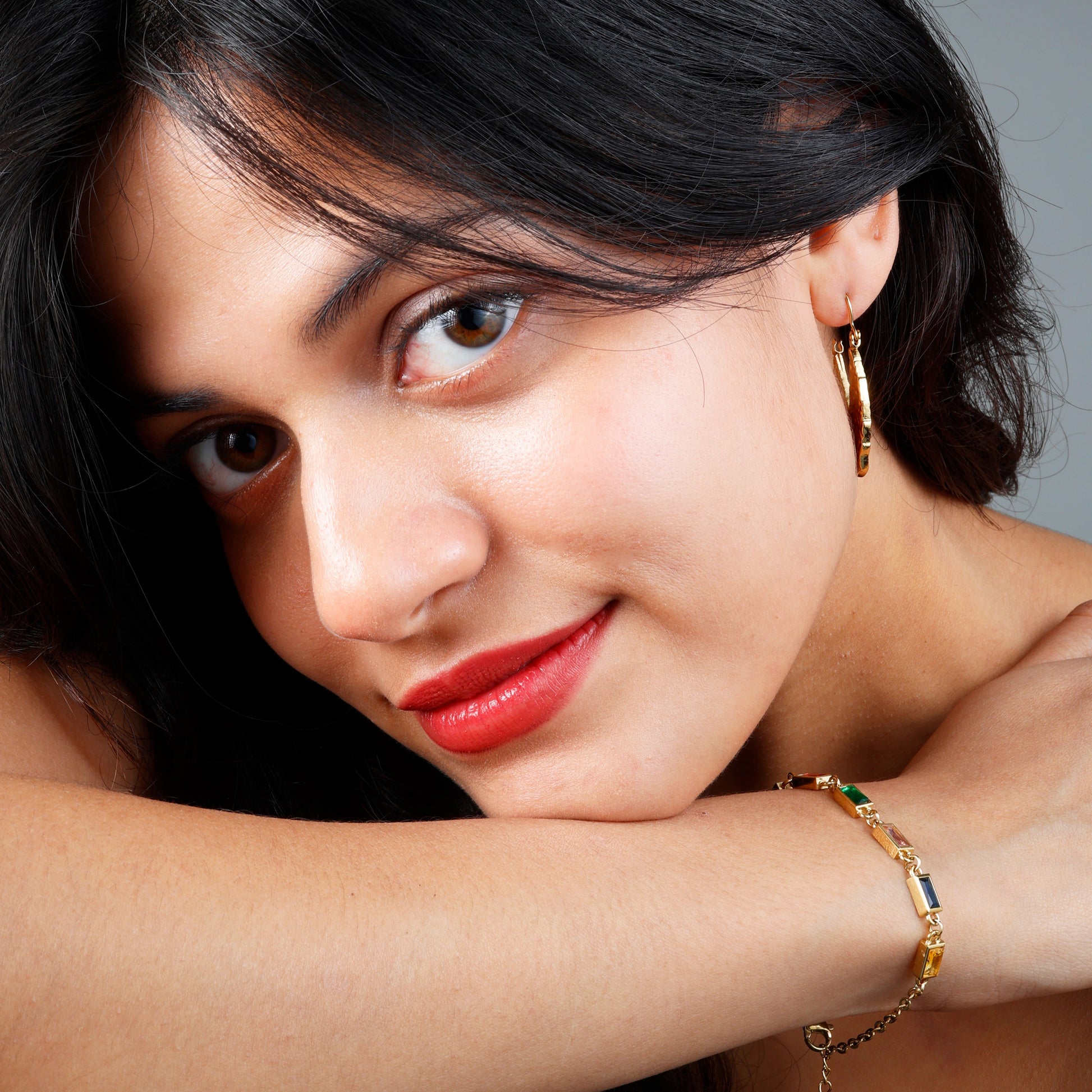 Vibrant Multi-Colored Stone Bracelet with yellow gold plating and hypoallergenic design.