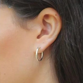 Sleek silver round hoops with endless closure design