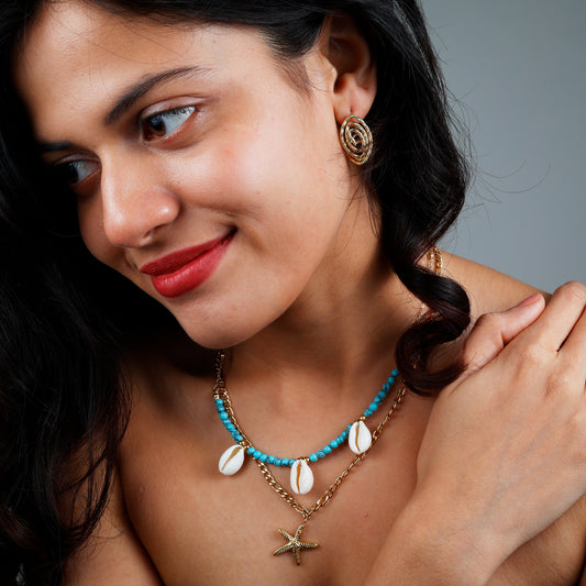 Elegant handcrafted seashell necklace with yellow gold plating and anti-tarnish finish.