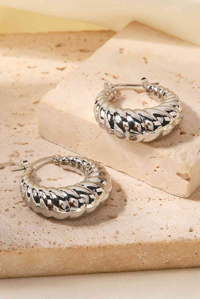 Peppy Pink Spiral Twist Hoop Earrings with a sleek, modern design—perfect for stylish, everyday wear.